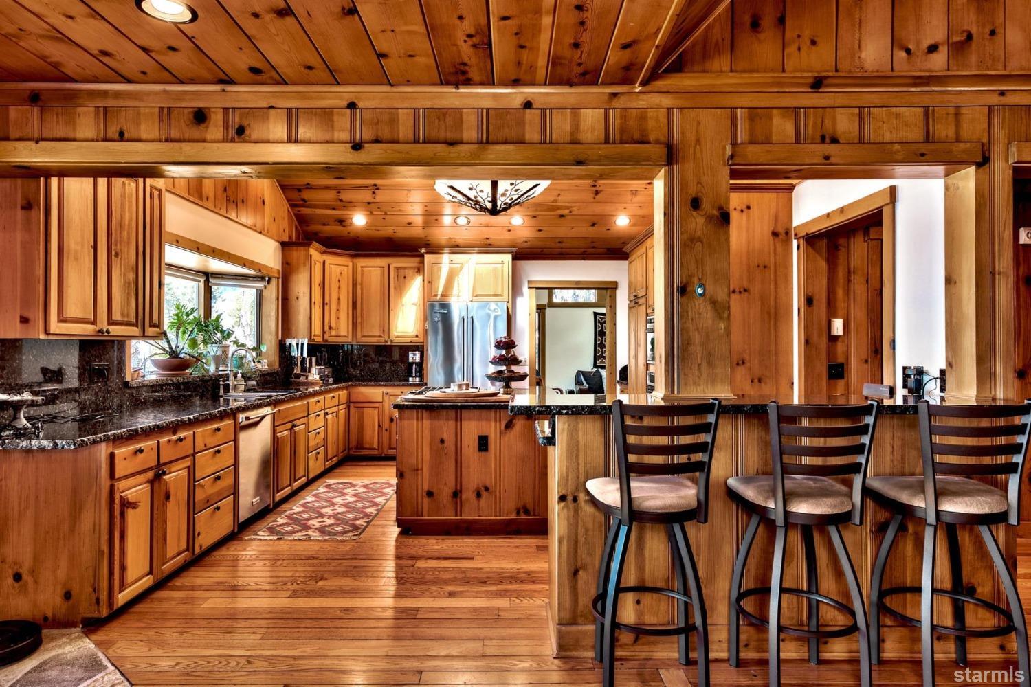 1472 Flowers Glenbrook, NV 89413 - Photo 17 of 25 a large kitchen with lots of counter top space and stainless steel appliances