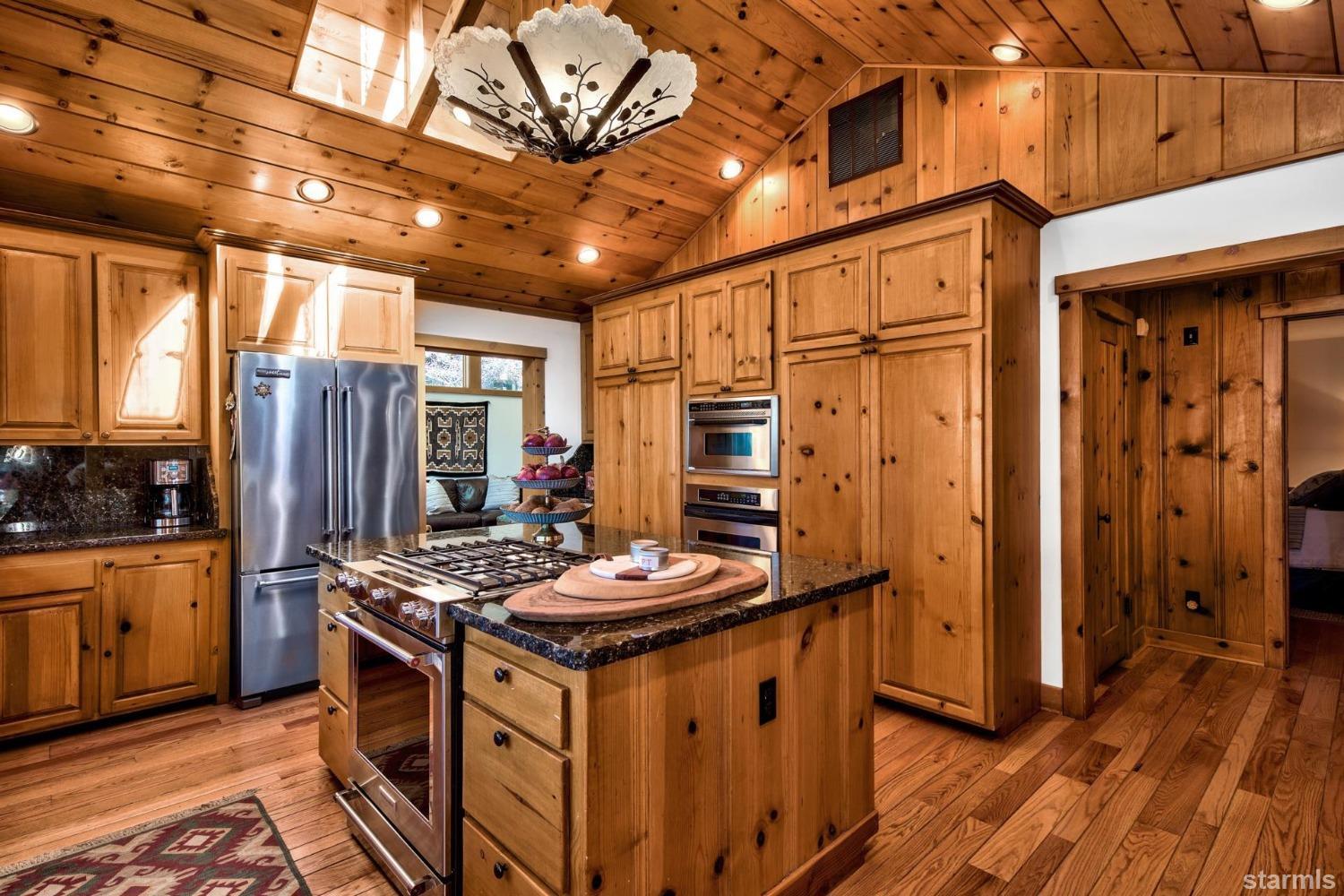 1472 Flowers Glenbrook, NV 89413 - Photo 18 of 25 a kitchen with stainless steel appliances granite countertop a stove and refrigerator