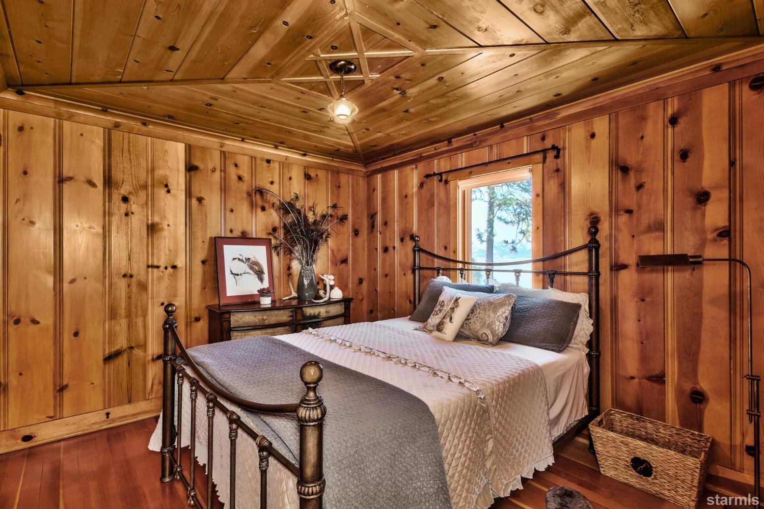 1472 Flowers Glenbrook, NV 89413 - Photo 22 of 25 a bedroom with a bed and wooden floor