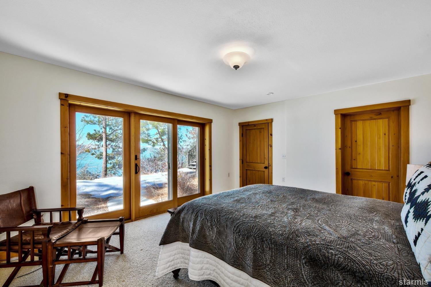 1472 Flowers Glenbrook, NV 89413 - Photo 23 of 25 a bedroom with a large bed and a large window