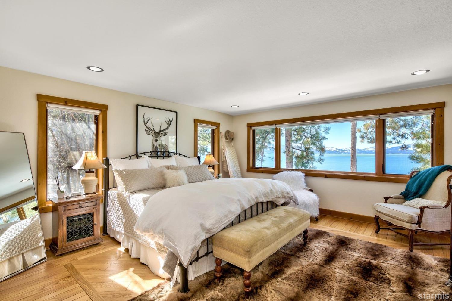 1472 Flowers Glenbrook, NV 89413 - Photo 24 of 25 a spacious bedroom with a bed and glass windows