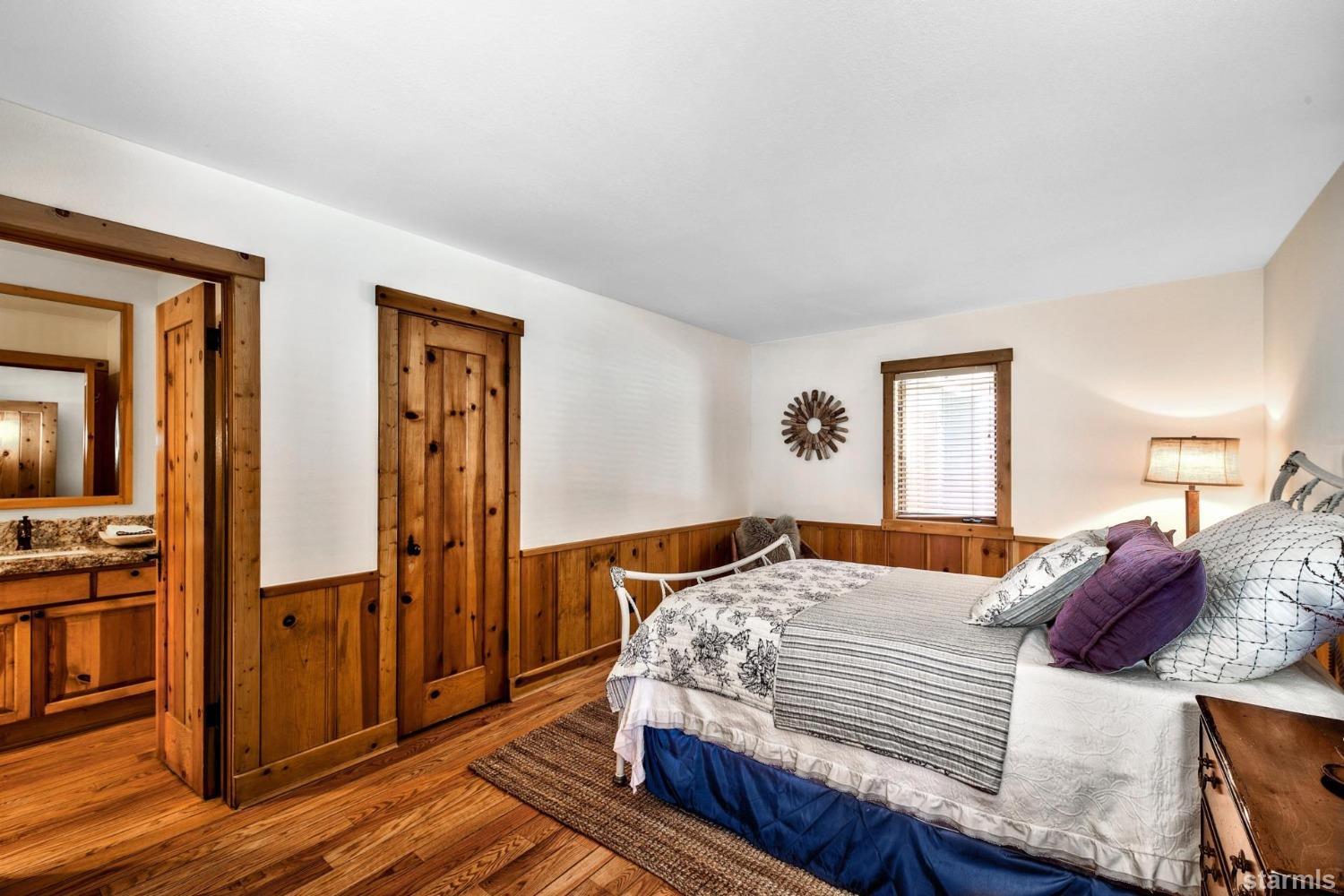 1472 Flowers Glenbrook, NV 89413 - Photo 25 of 25 a bedroom with a bed and wooden floor