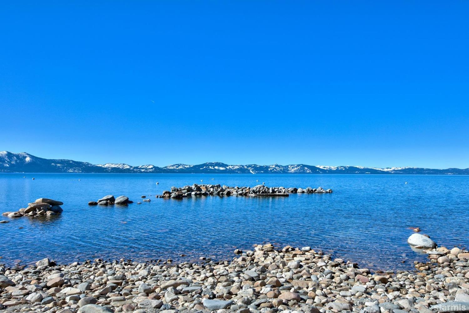 1472 Flowers Glenbrook, NV 89413 - Photo 3 of 25 a view of a lake with houses in the back