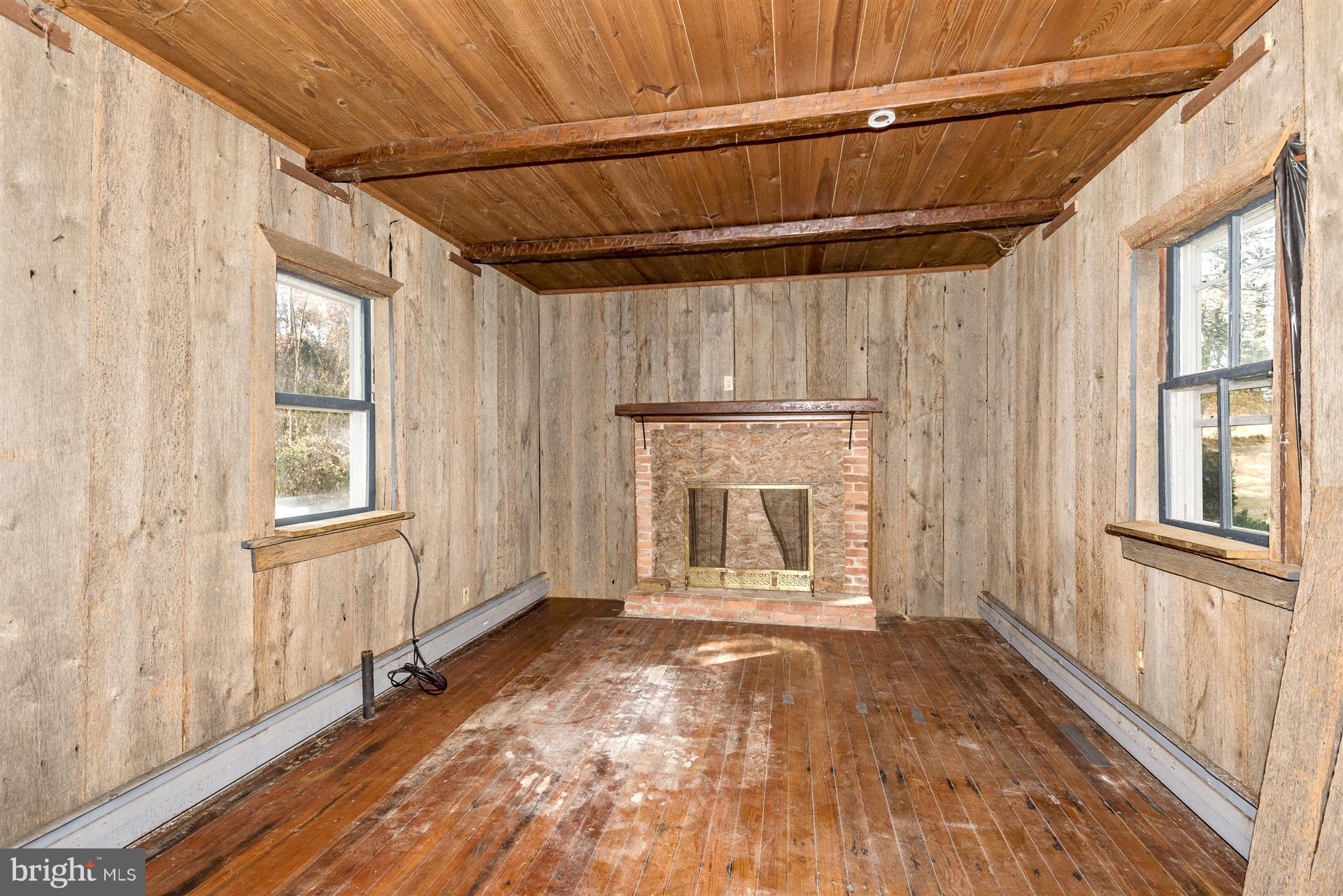 22326 Cave Hill Road Smithsburg, MD 21783 - Photo 16 of 30 Cool Summer Kitchen has wood floors & hearth