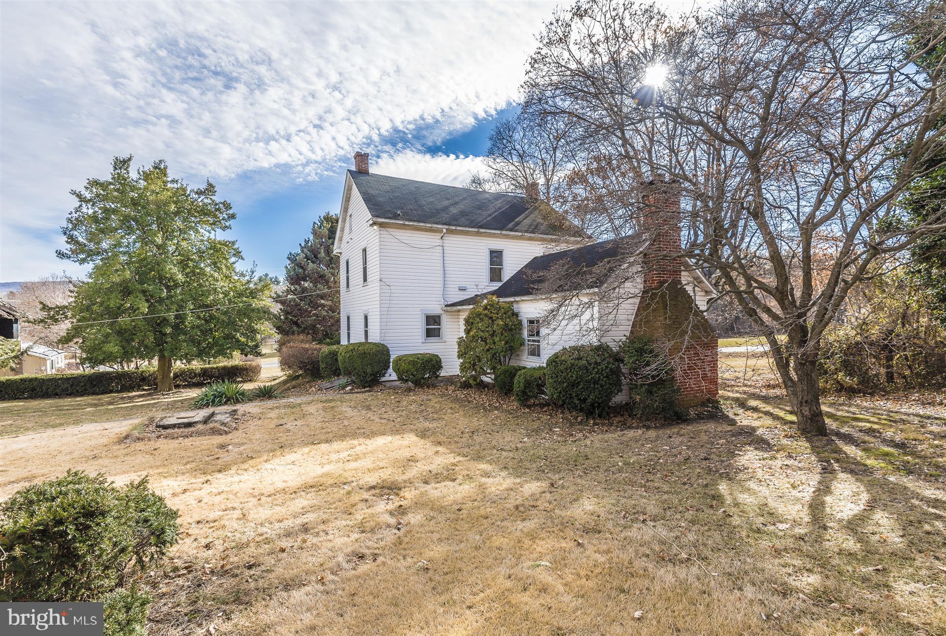 22326 Cave Hill Road Smithsburg, MD 21783 - Photo 6 of 30 Landscaping includes lovely holly tree to left.