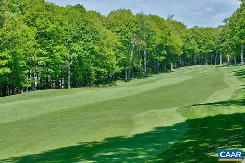 a view of a house with backyard porch and sitting area