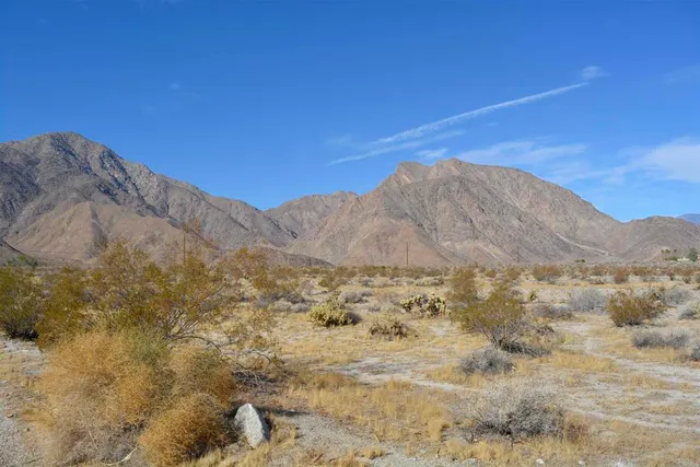 a view of mountain view with mountains in the background