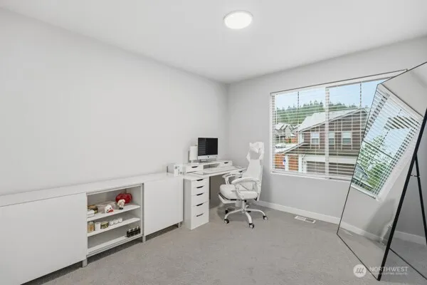 a workspace with furniture and a window