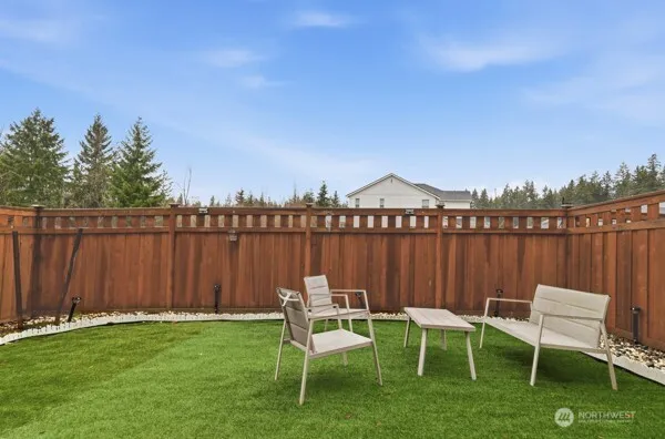 a view of a chair and tables in the patio