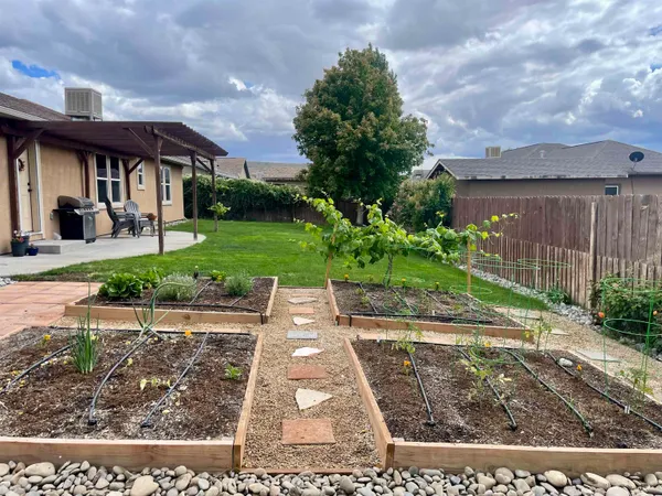 a view of a backyard with sitting area