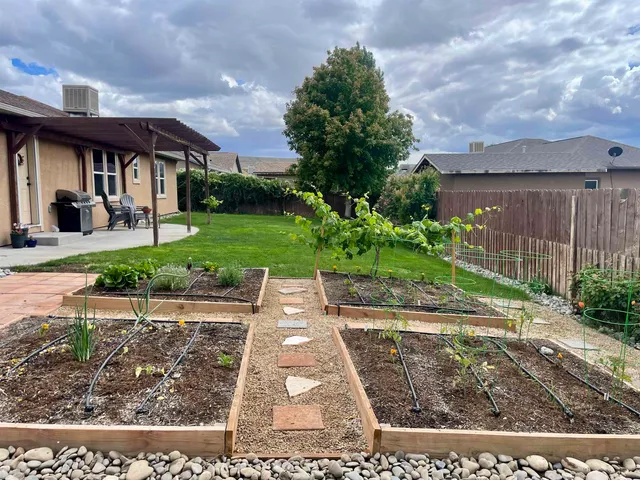 a view of a backyard with sitting area