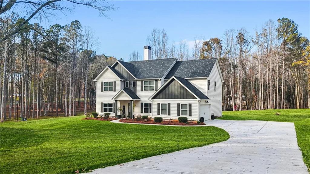 435 Paynes Lake Road Carrollton, GA 30116 - Photo 2 of 11 a front view of a house with garden