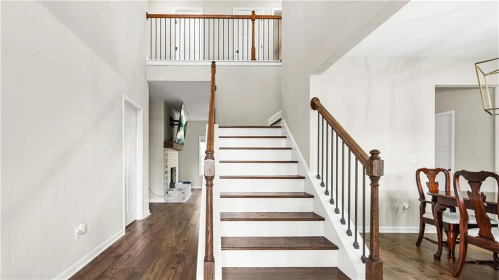 435 Paynes Lake Road Carrollton, GA 30116 - Photo 3 of 11 a view of entryway with wooden floor and stairs