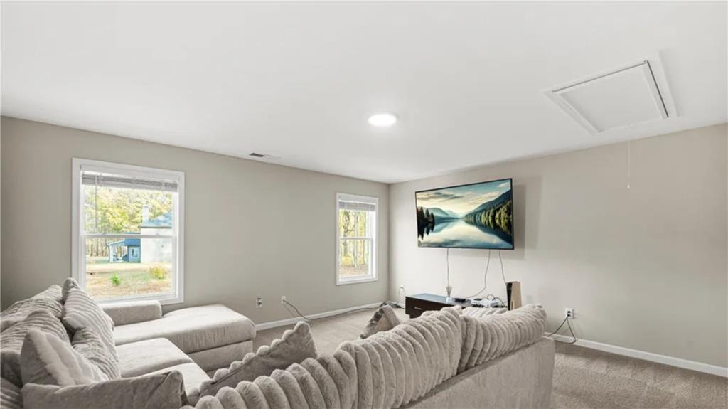 435 Paynes Lake Road Carrollton, GA 30116 - Photo 6 of 11 a living room with furniture and a flat screen tv