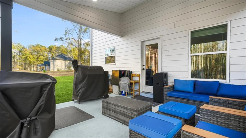 435 Paynes Lake Road Carrollton, GA 30116 - Photo 9 of 11 a living room with furniture and a window