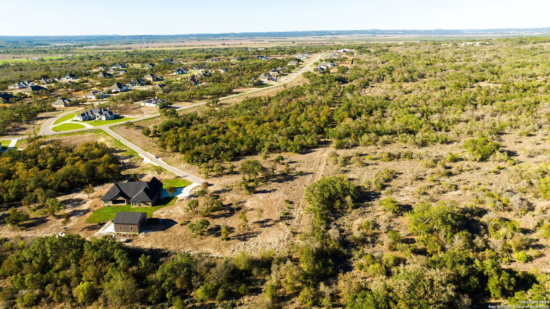 Lot 20 Stone Loop Castroville, TX 78009 - Photo 14 of 17 an aerial view of residential houses with outdoor space