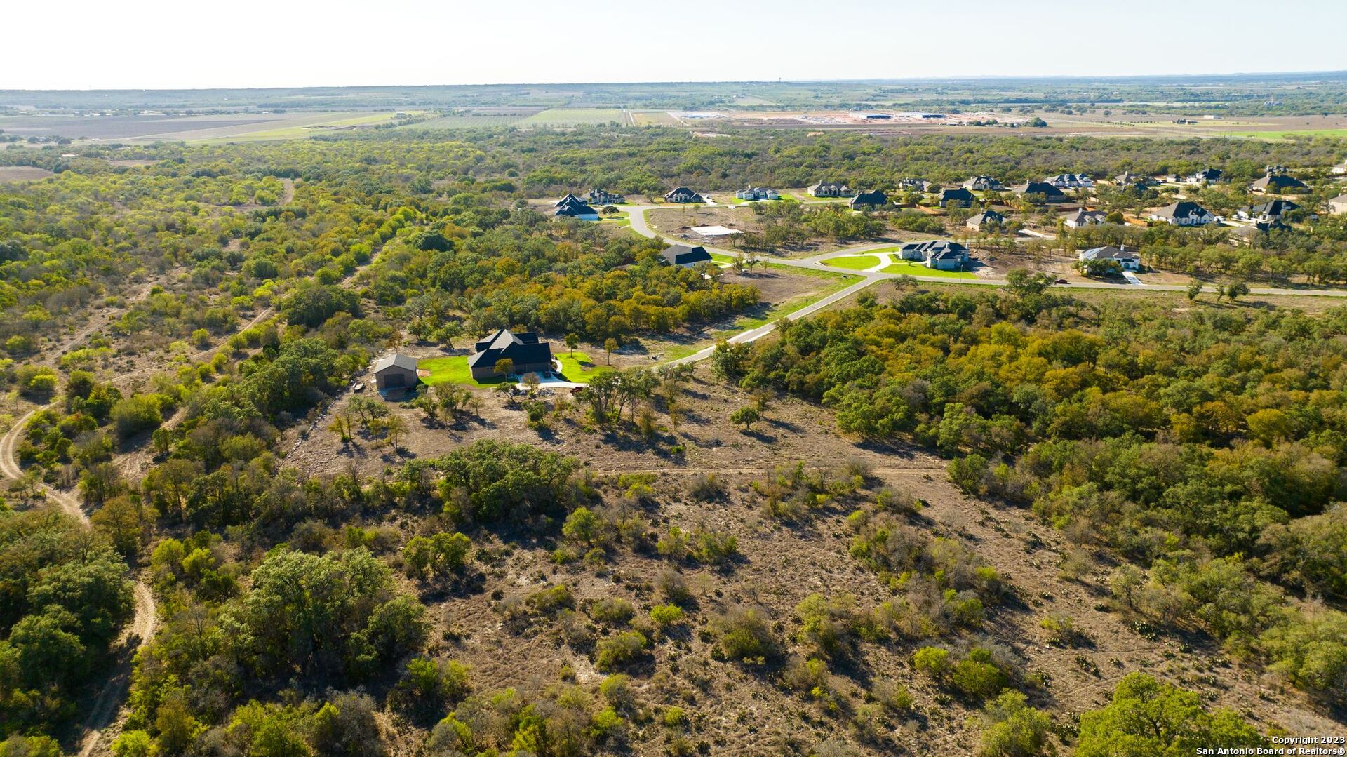 Lot 20 Stone Loop Castroville, TX 78009 - Photo 15 of 17 an aerial view of residential houses with outdoor space and trees