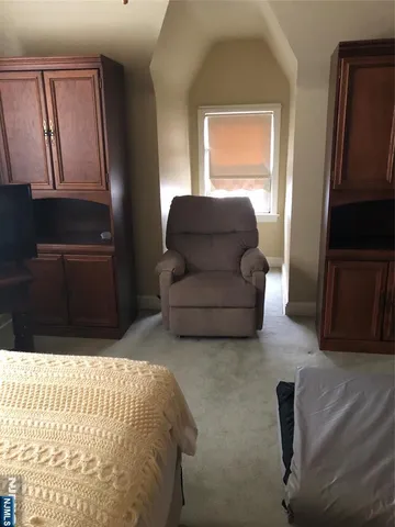 a bed room with furniture and a closet