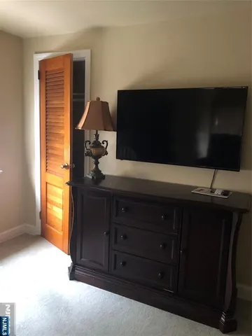 a kitchen with a sink and a mirror