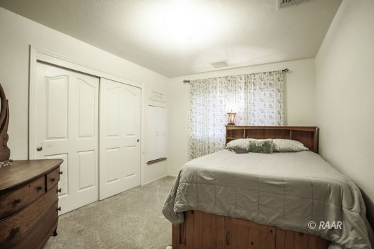 532 Amanda Street Ridgecrest, CA 93555 - Photo 22 of 35 a bedroom with a bed and a window