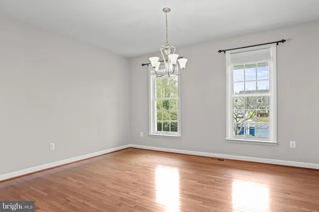 a large kitchen with stainless steel appliances granite countertop a stove a sink dishwasher and a refrigerator