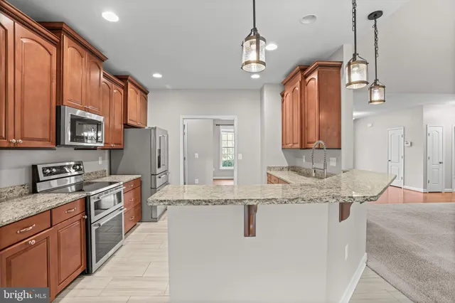 a view of a house with a barbeque and wooden floor