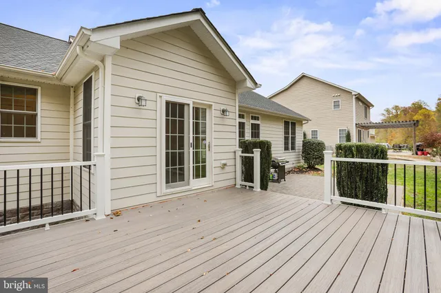 a view of a livingroom with a ceiling fan and window