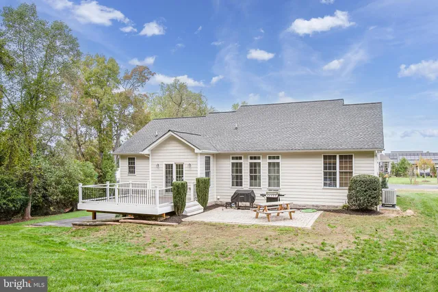an empty room with chandelier fan