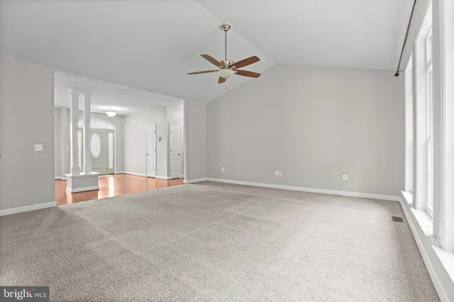 an empty room with closet area