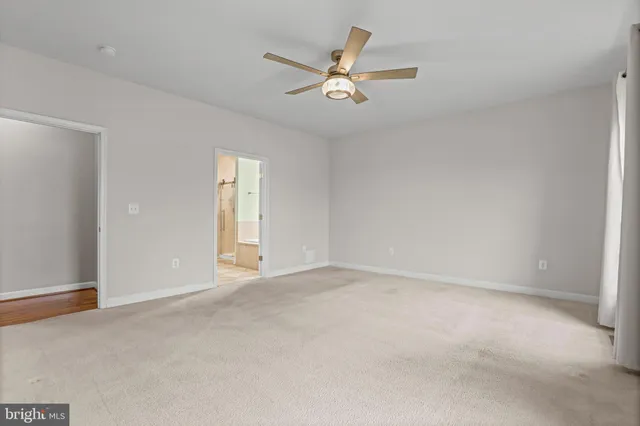 a view of a room with gym equipment and a table