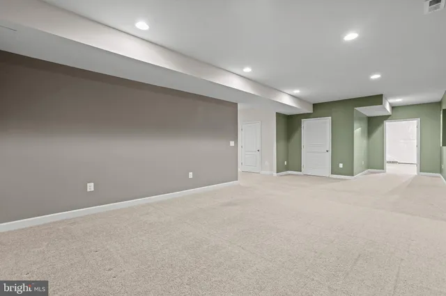 an aerial view of a house with a swimming pool