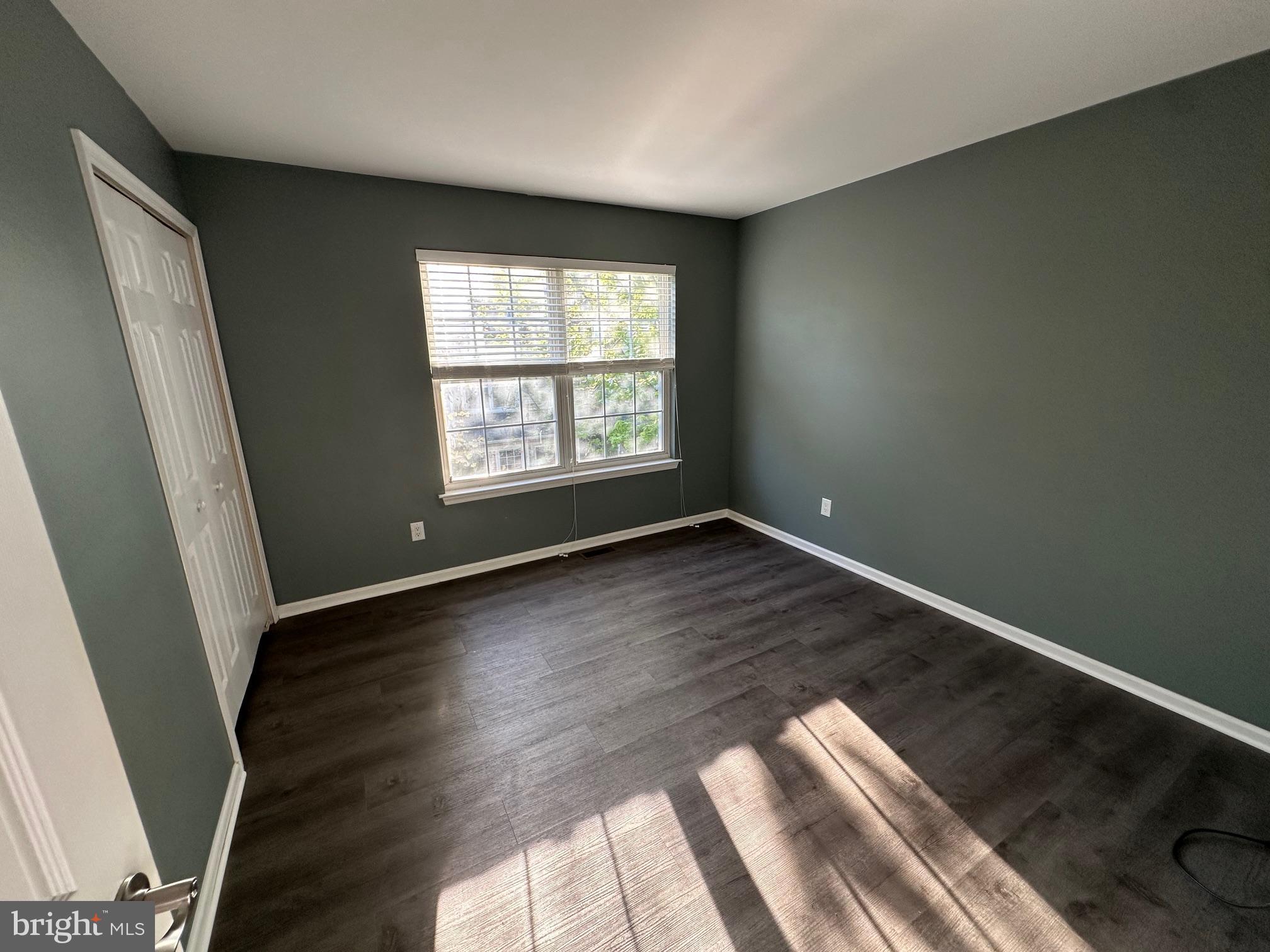 6104 Coventry Way Mount Laurel, NJ 08054 - Photo 14 of 17 wooden floor in an empty room with a window