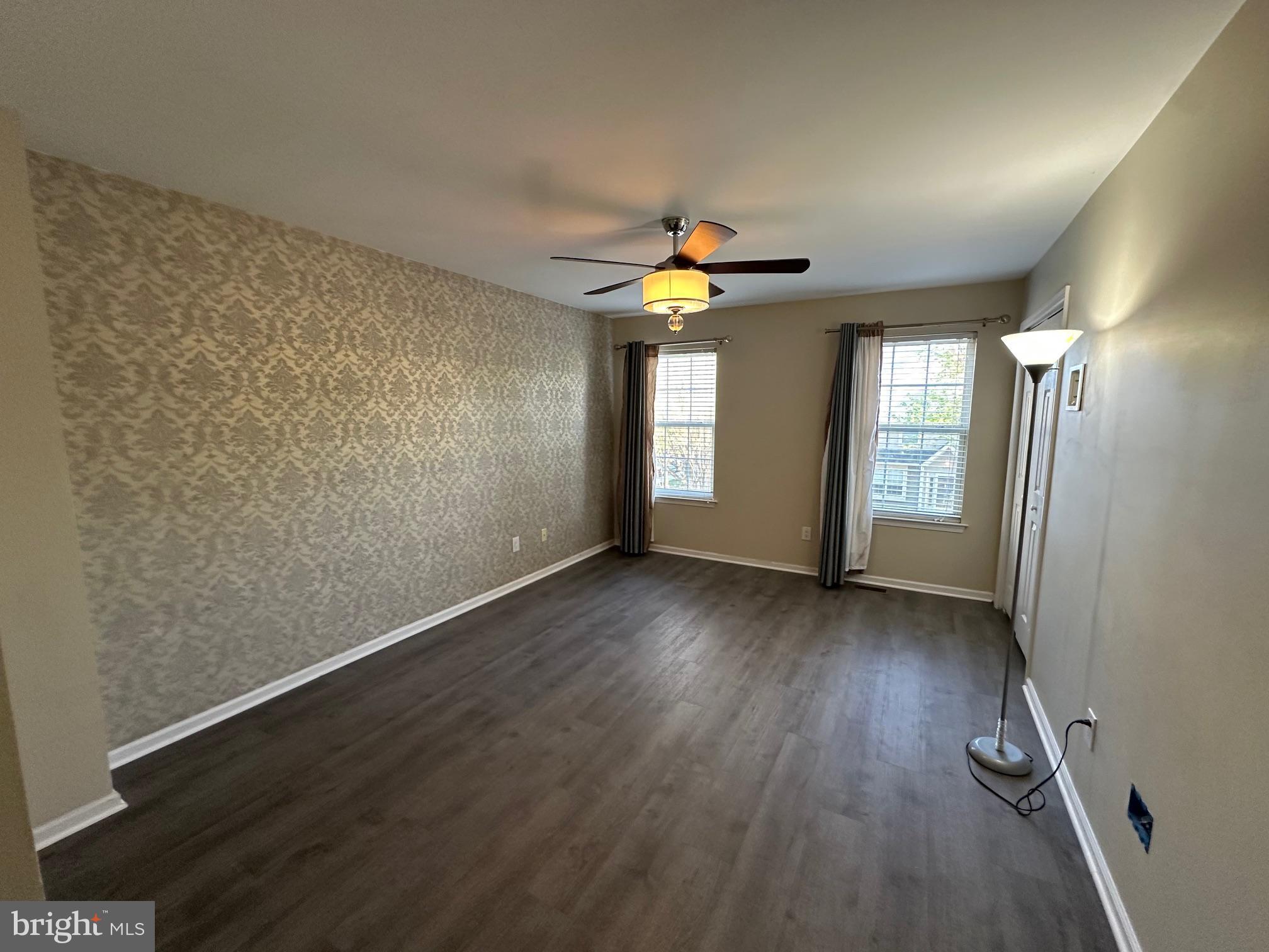 6104 Coventry Way Mount Laurel, NJ 08054 - Photo 10 of 17 wooden floor in an empty room with a window
