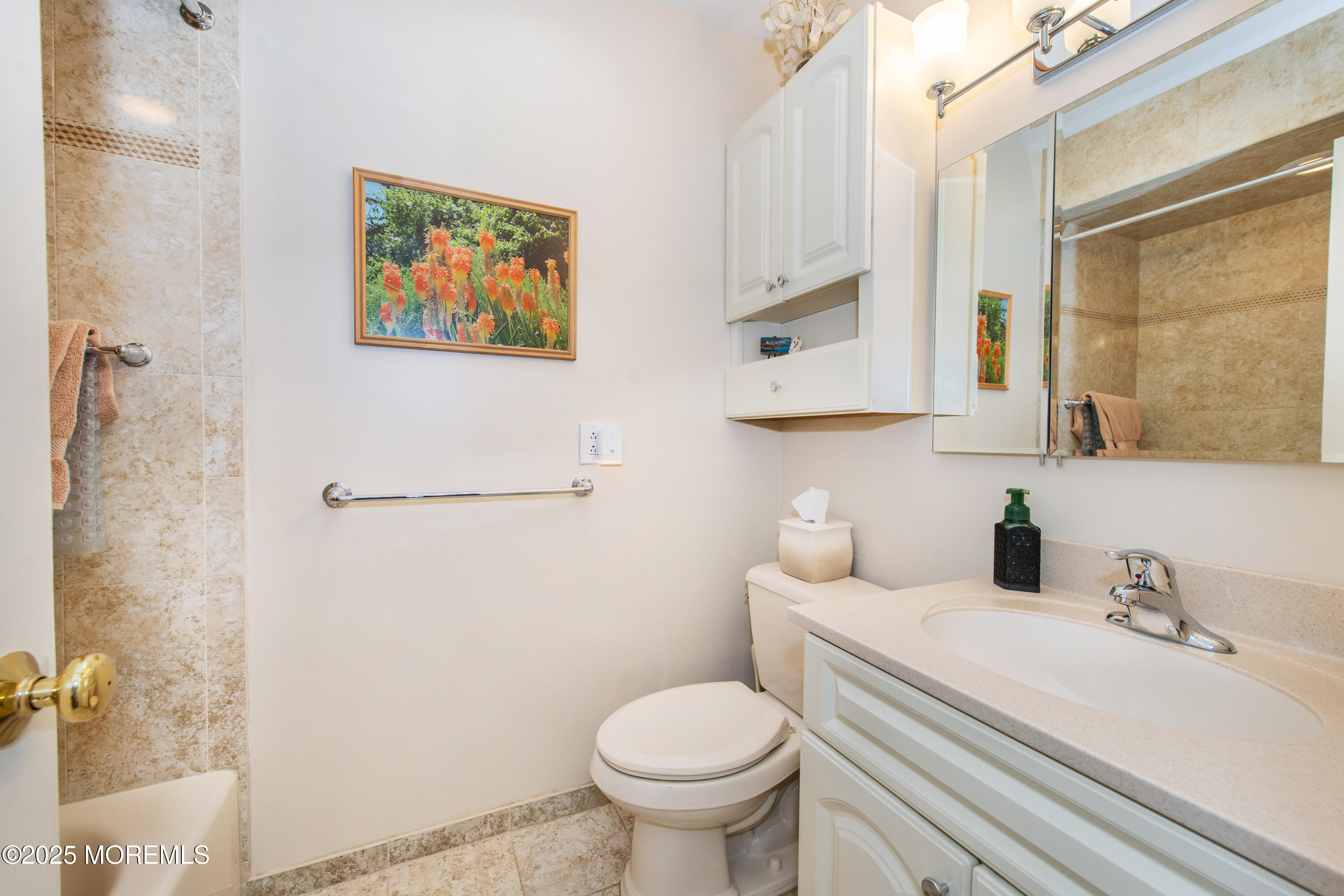 4 Maxwell Lane Manalapan, NJ 07726 - Photo 18 of 32 a bathroom with a toilet sink and mirror