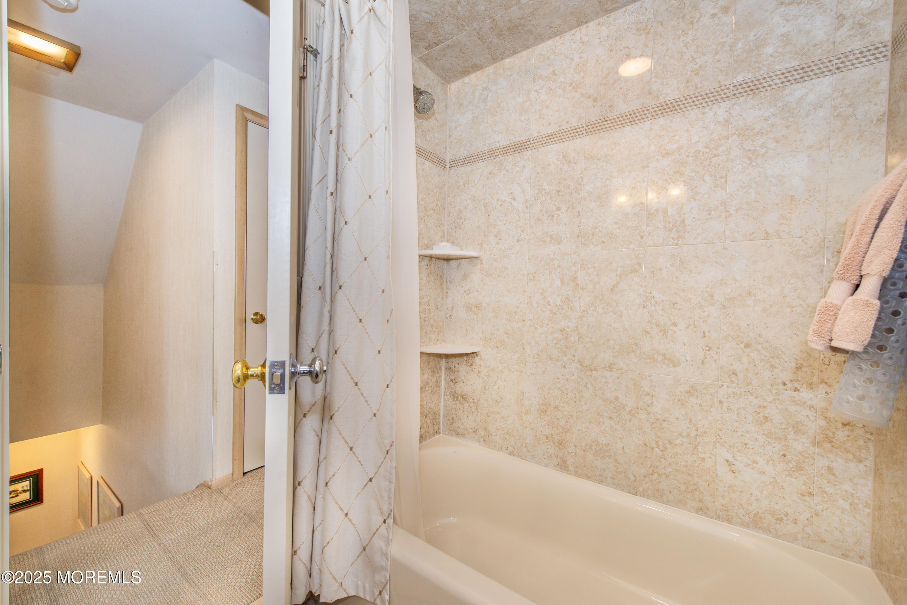 4 Maxwell Lane Manalapan, NJ 07726 - Photo 19 of 32 a bathroom with a bathtub and shower