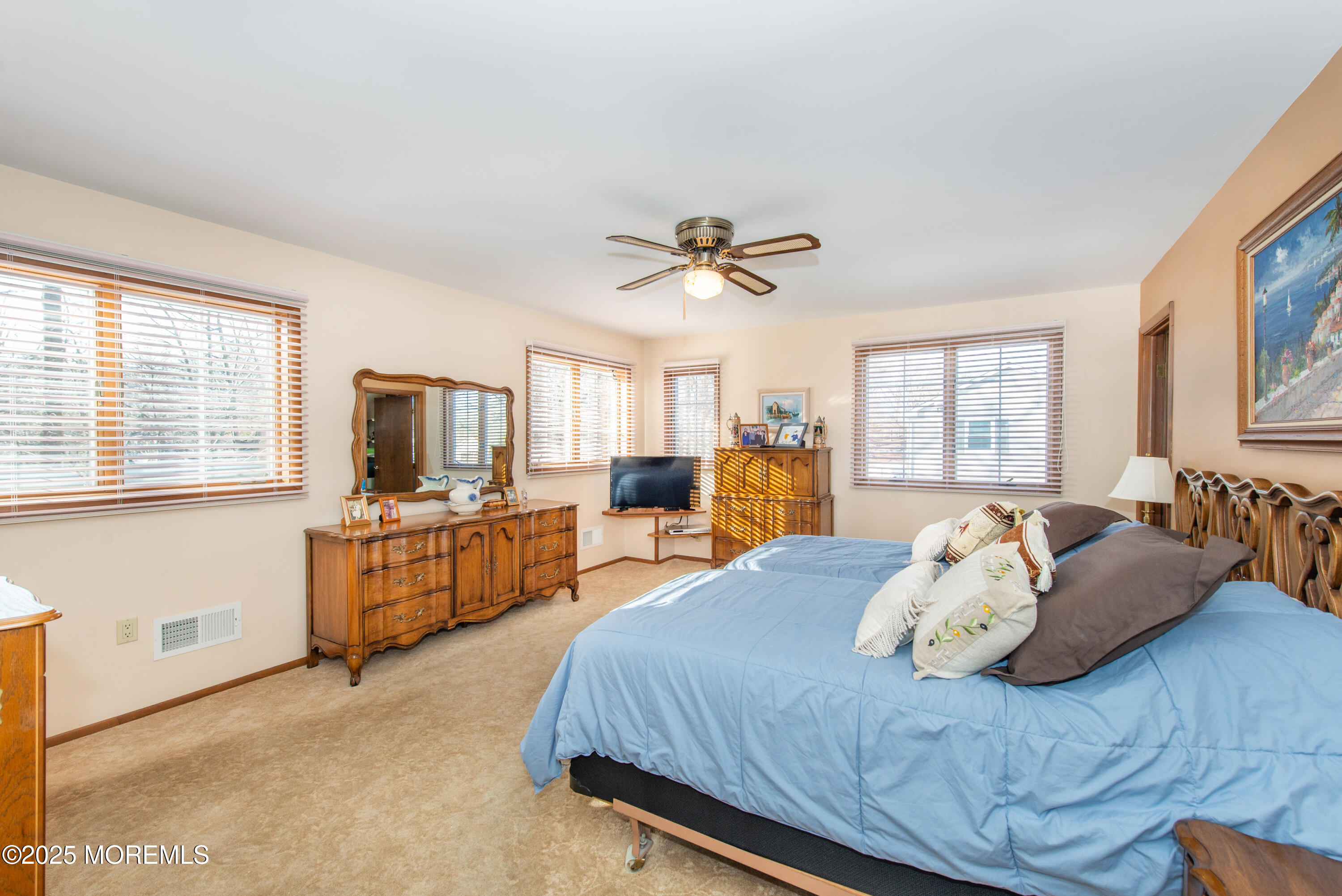 4 Maxwell Lane Manalapan, NJ 07726 - Photo 20 of 32 a bedroom with a large bed and a window