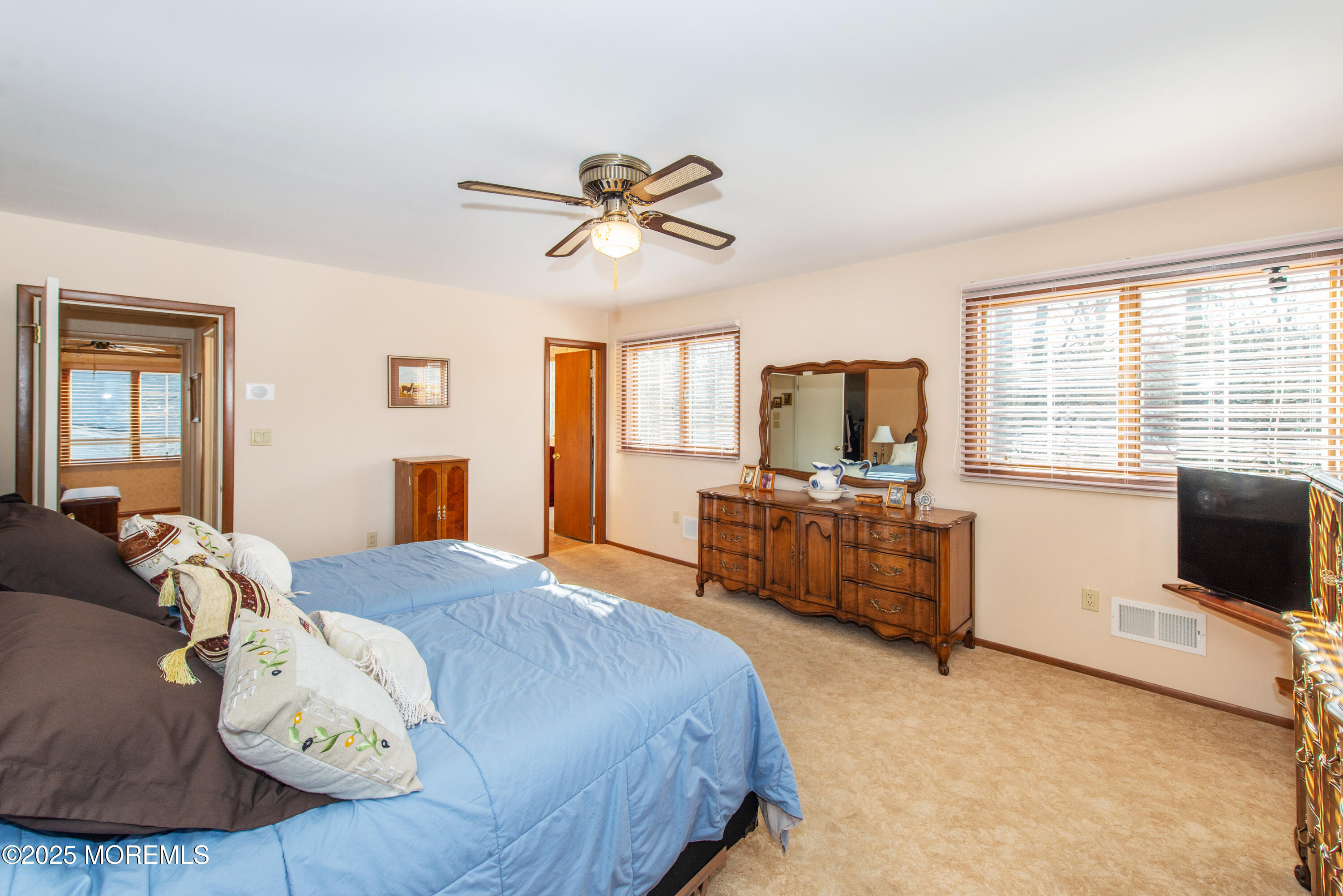 4 Maxwell Lane Manalapan, NJ 07726 - Photo 21 of 32 a bedroom with a bed and a television