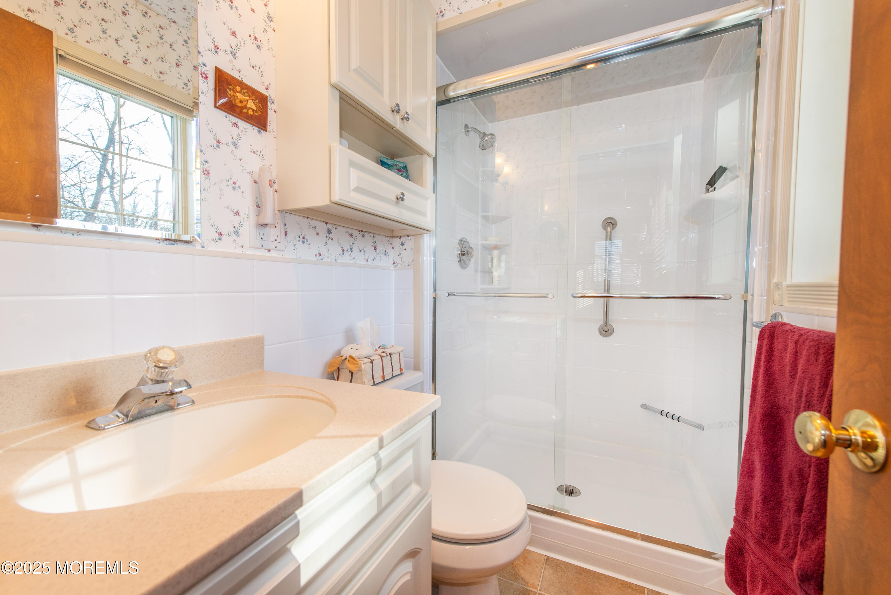 4 Maxwell Lane Manalapan, NJ 07726 - Photo 23 of 32 a bathroom with a sink toilet and shower