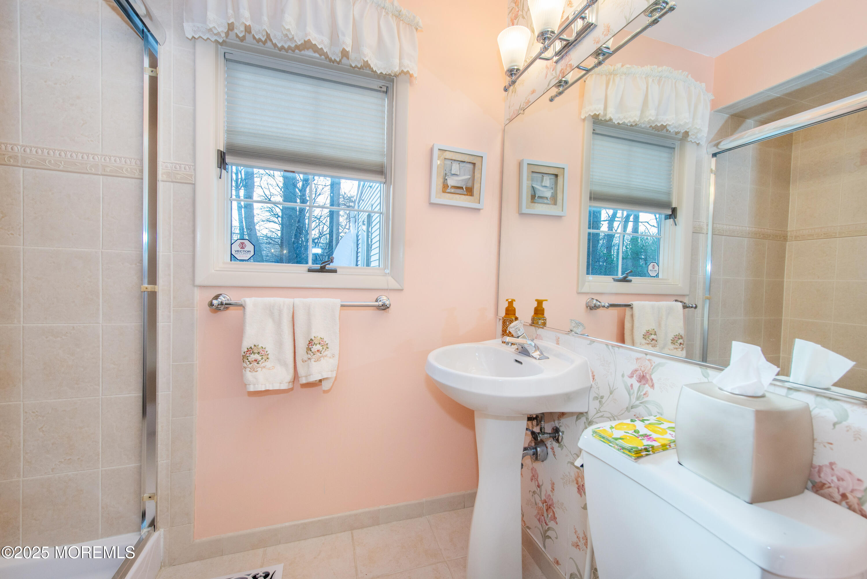 4 Maxwell Lane Manalapan, NJ 07726 - Photo 25 of 32 a bathroom with a sink and a mirror