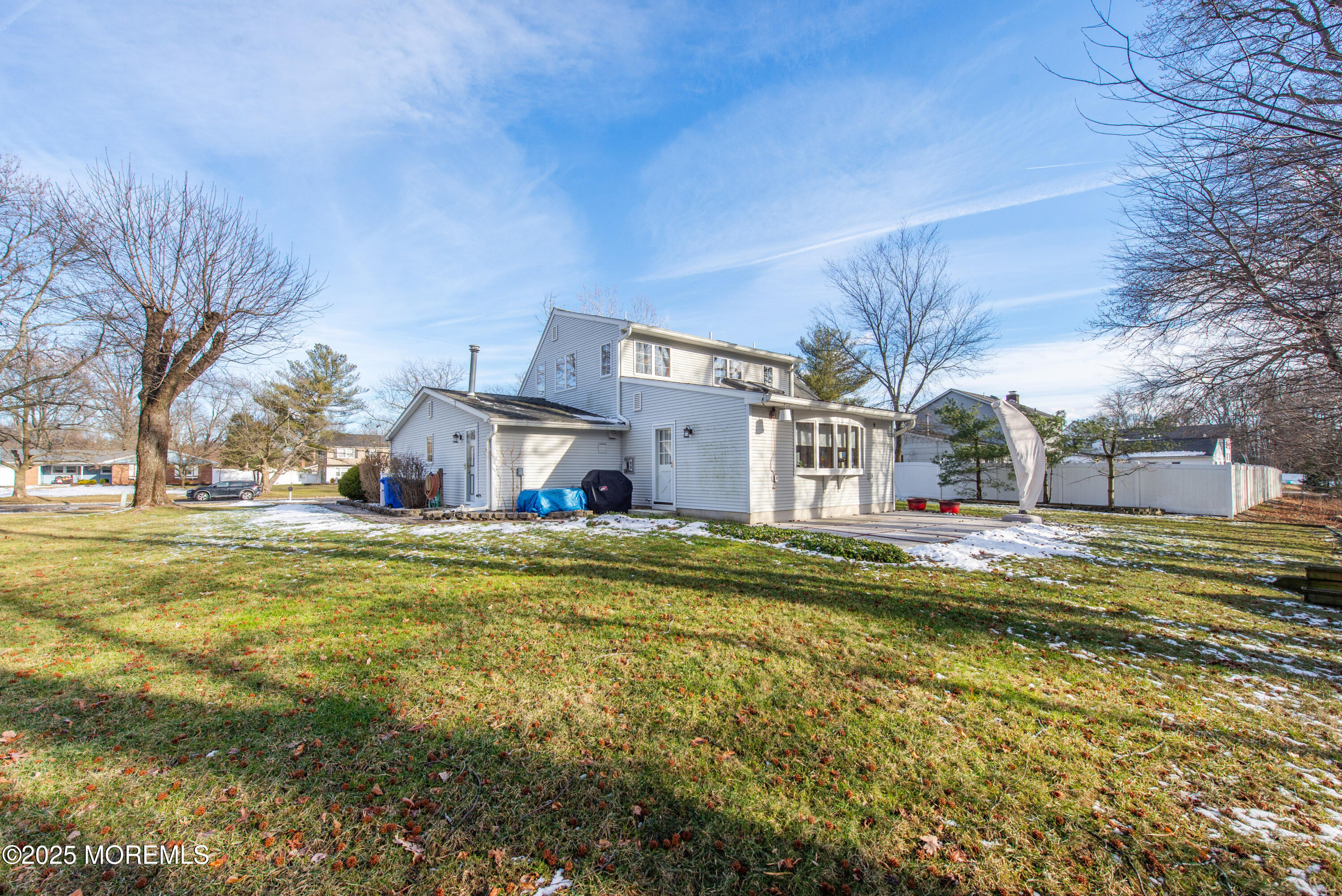 4 Maxwell Lane Manalapan, NJ 07726 - Photo 26 of 32 a view of a house with a big yard and large trees