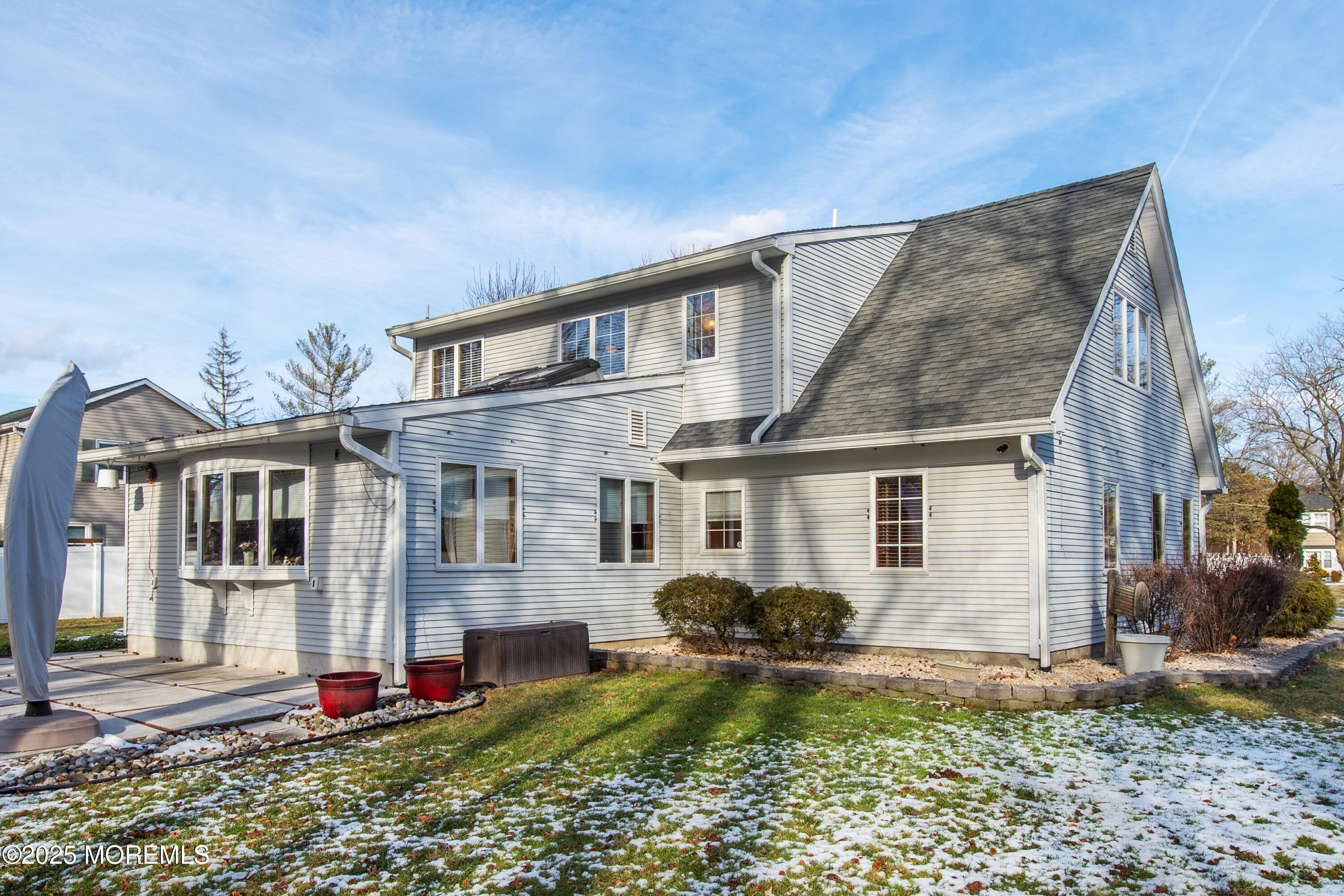 4 Maxwell Lane Manalapan, NJ 07726 - Photo 27 of 32 a front view of a house with garden