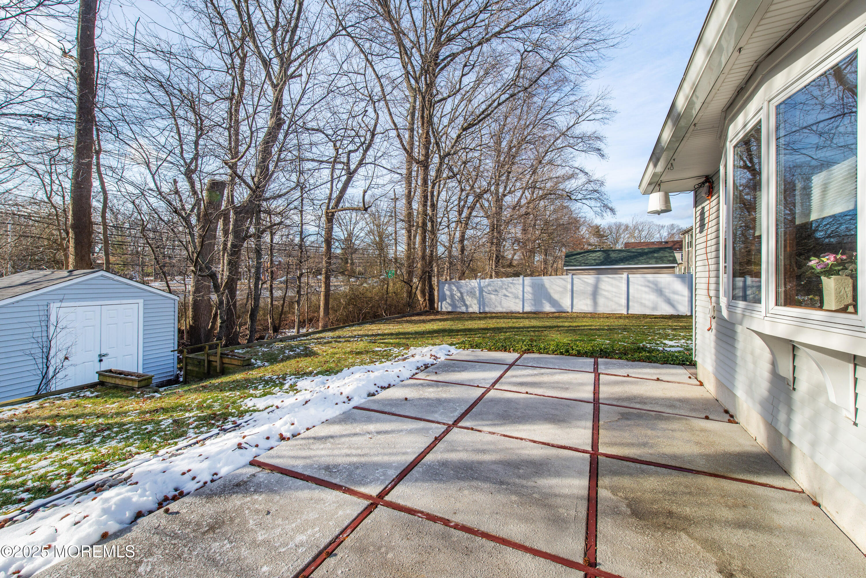 4 Maxwell Lane Manalapan, NJ 07726 - Photo 29 of 32 a view of a backyard with a garden