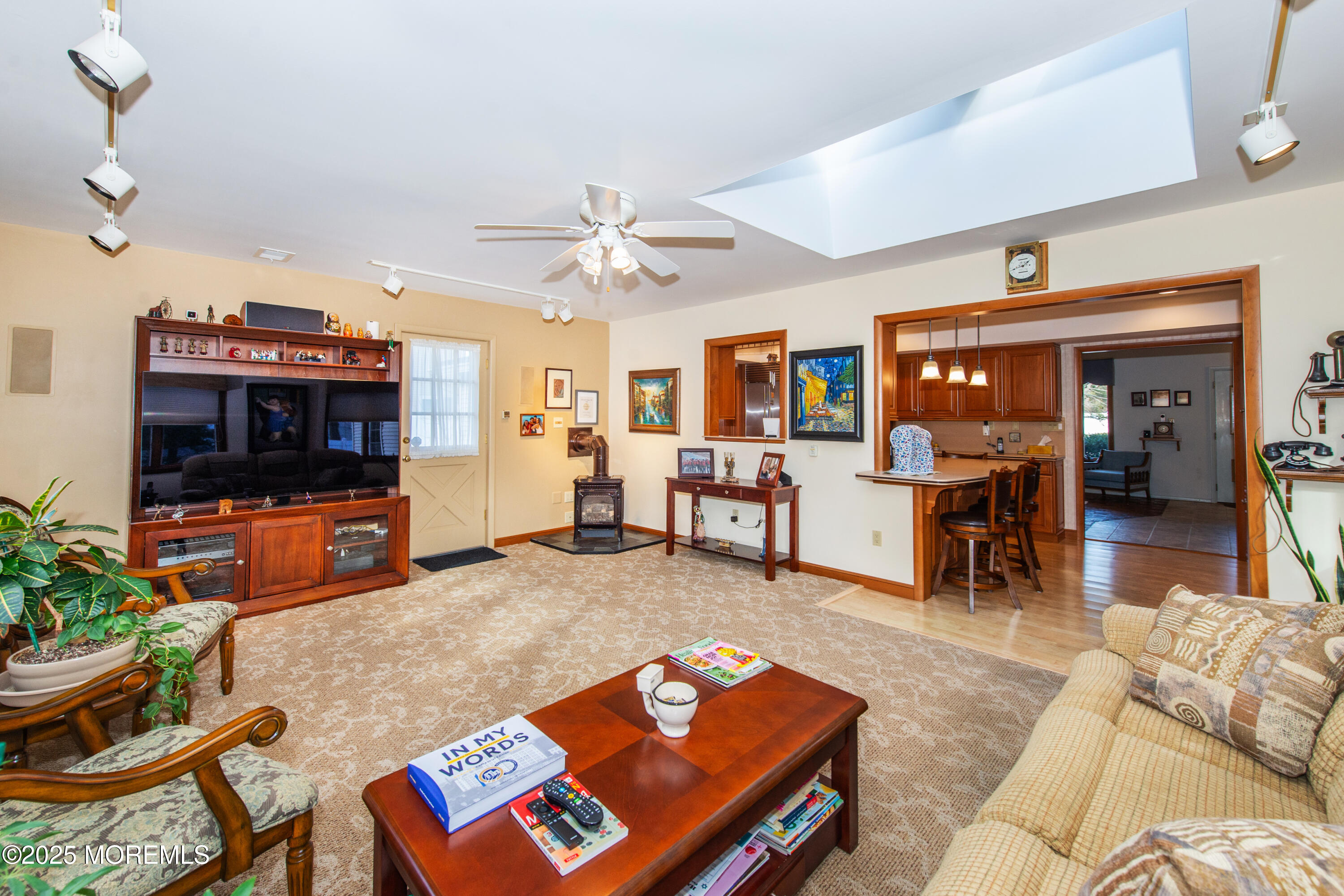 4 Maxwell Lane Manalapan, NJ 07726 - Photo 4 of 32 a living room with furniture and a flat screen tv