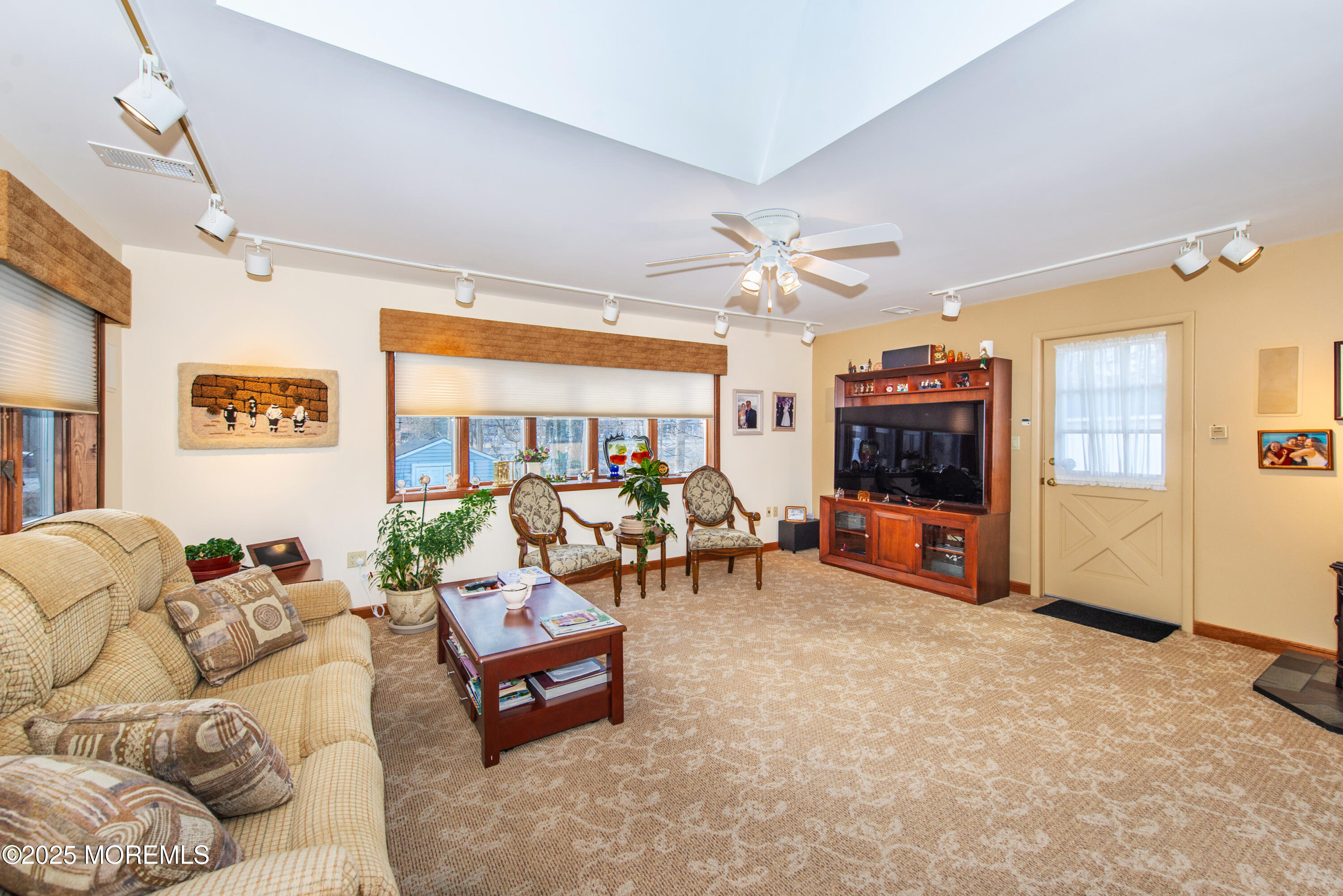 4 Maxwell Lane Manalapan, NJ 07726 - Photo 5 of 32 a living room with furniture and a flat screen tv