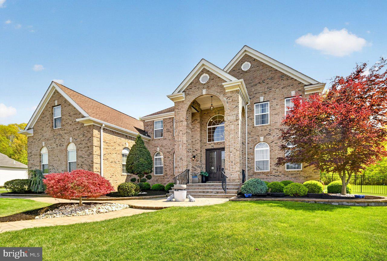 45 Emerald Road Robbinsville, NJ 08691 - Photo 1 of 57 Elegant brick home with lush landscaping.