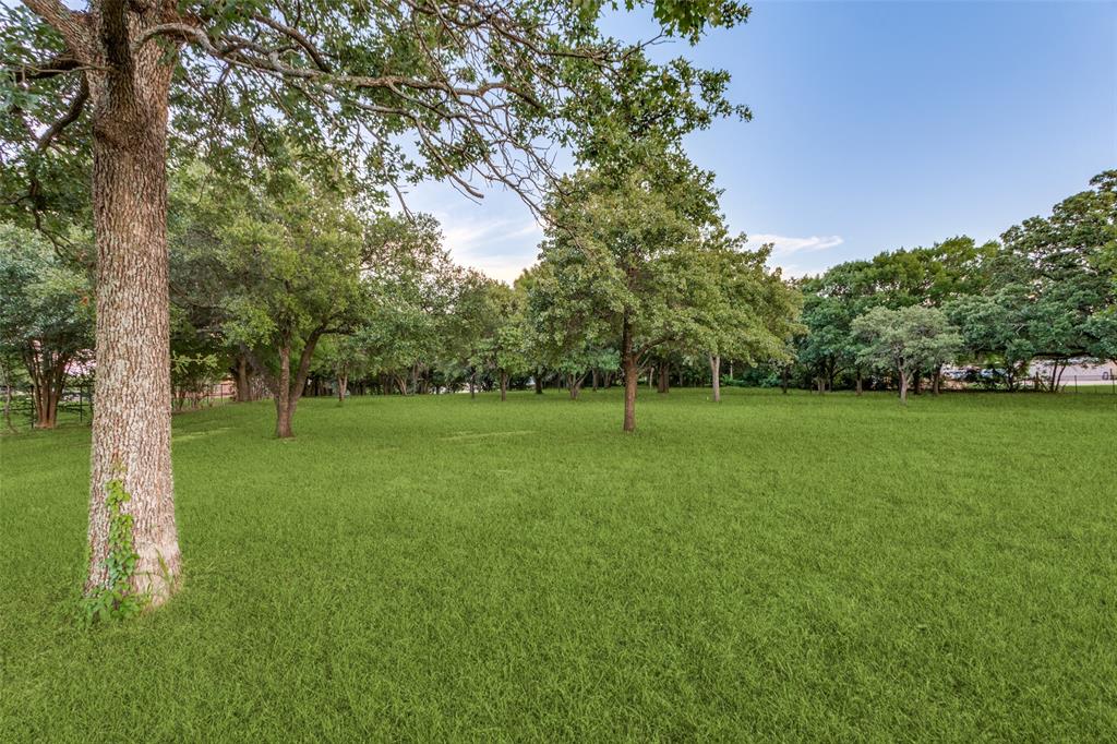 262 Turner Warnell Road Mansfield, TX 76063 - Photo 3 of 17 a view of a park with large trees