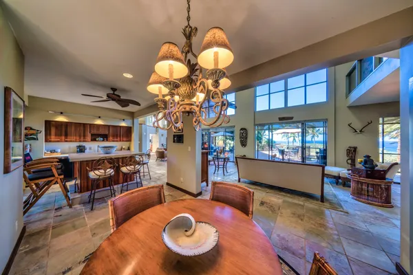 a living room with dining room and wooden floor