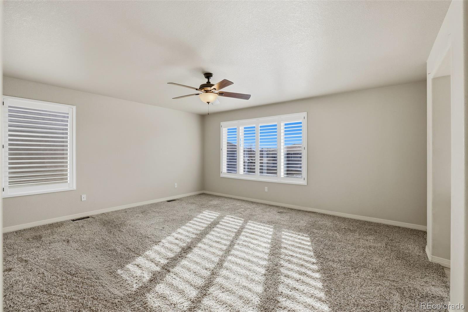 2224 Reed Grass Way Colorado Springs, CO 80915 - Photo 26 of 45 a view of an empty room with a window