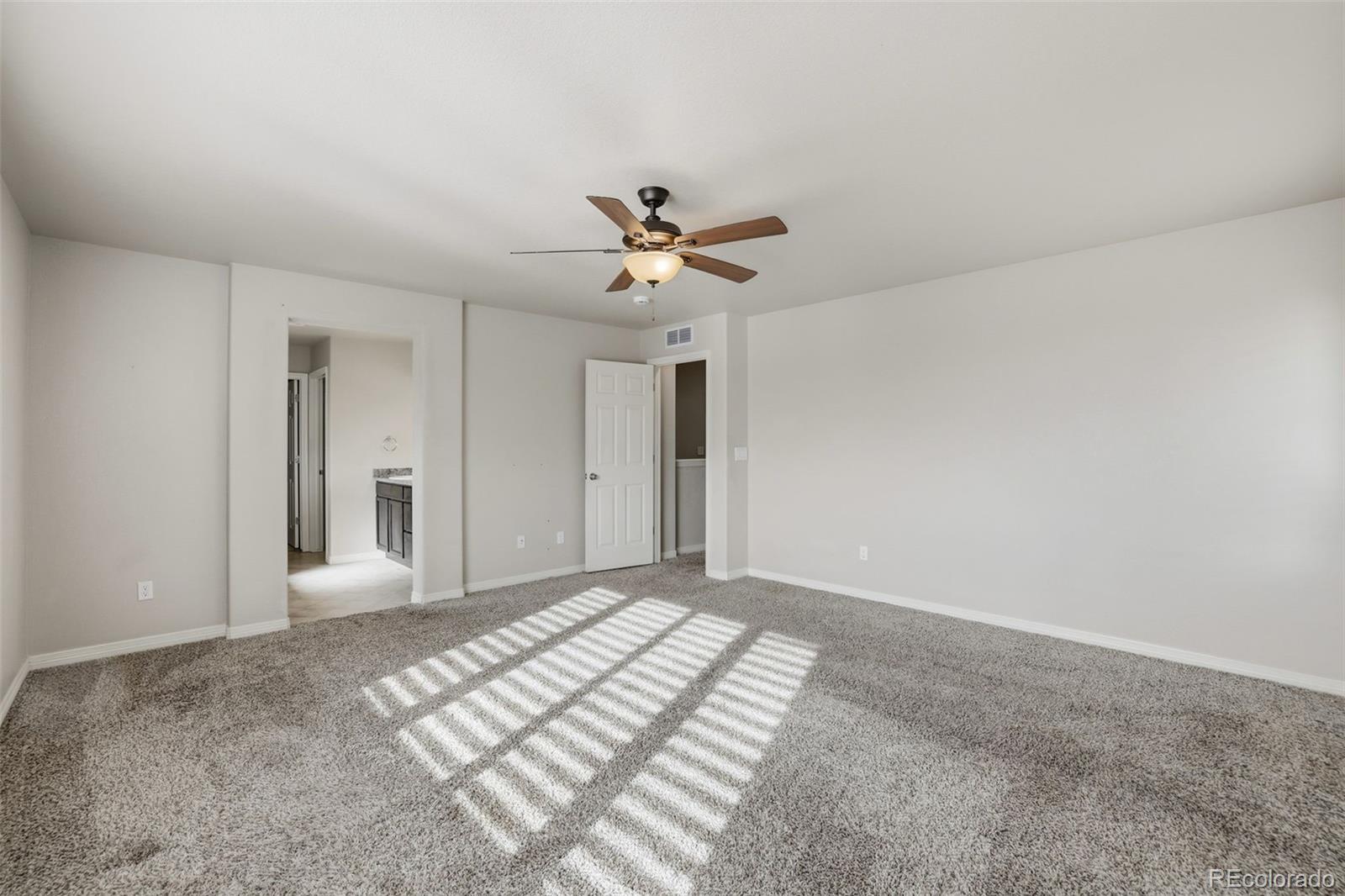 2224 Reed Grass Way Colorado Springs, CO 80915 - Photo 28 of 45 a view of a livingroom with a ceiling fan