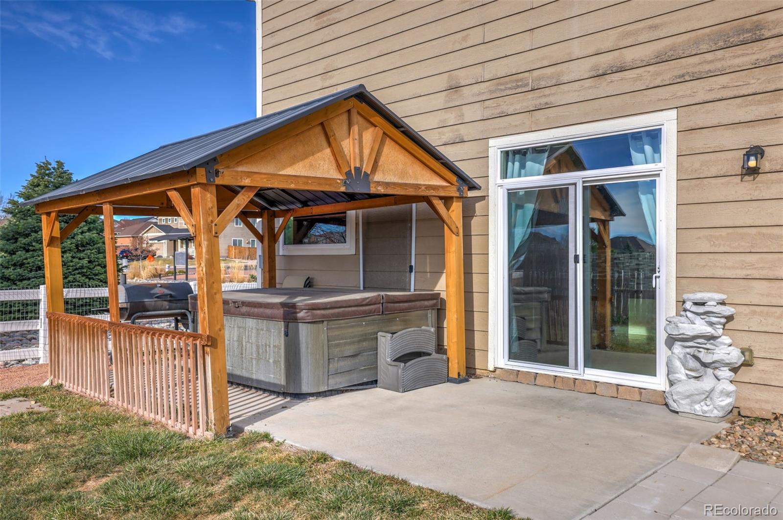 2224 Reed Grass Way Colorado Springs, CO 80915 - Photo 42 of 45 a view of a house with entryway and wooden fence